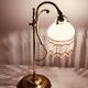 Old lamp adjustable on foot tulip golden brass.