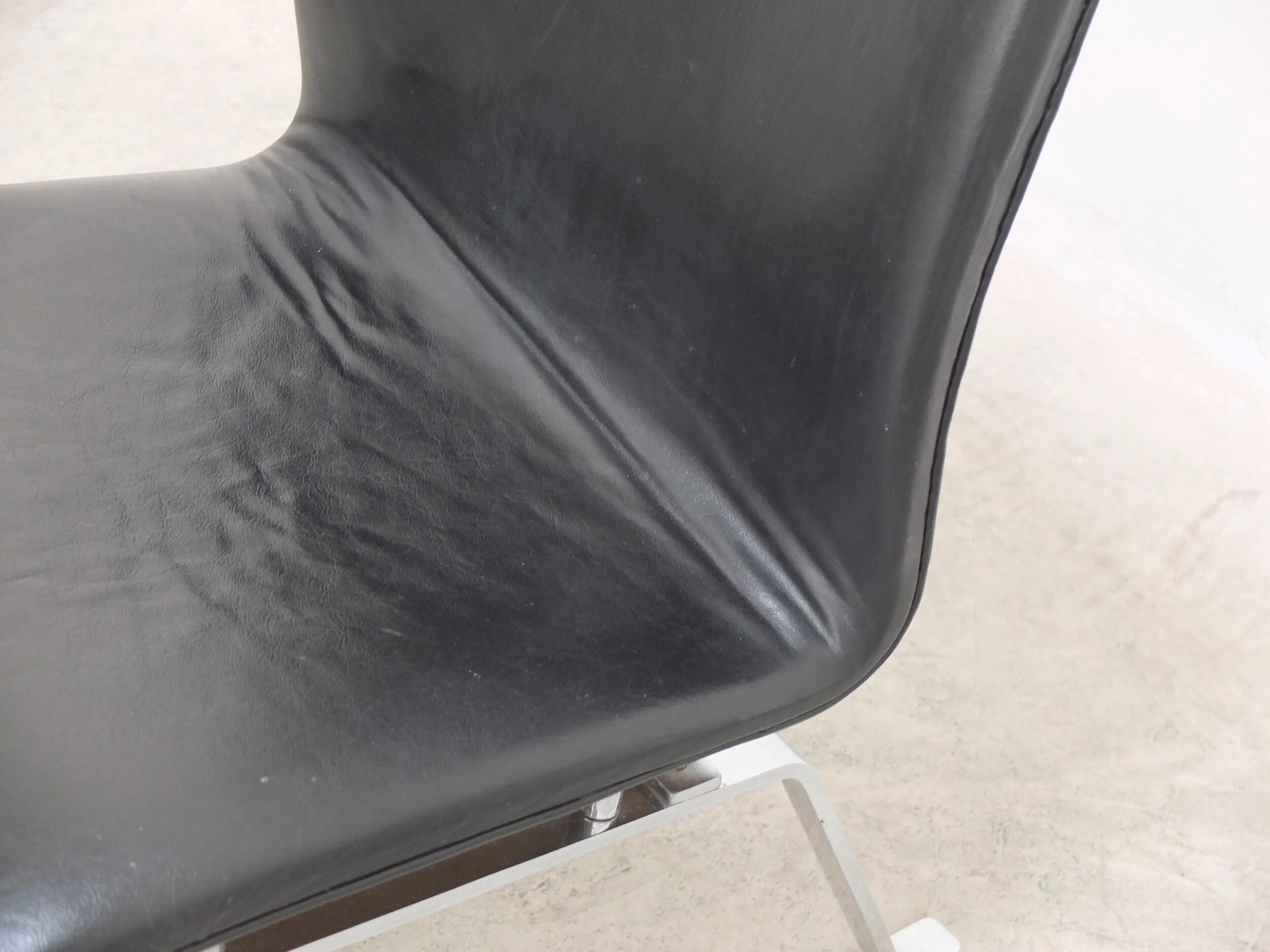 Unique black leather & steel modernist lounge chair, 1960s