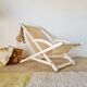 Old white wood deck chair Triconfort