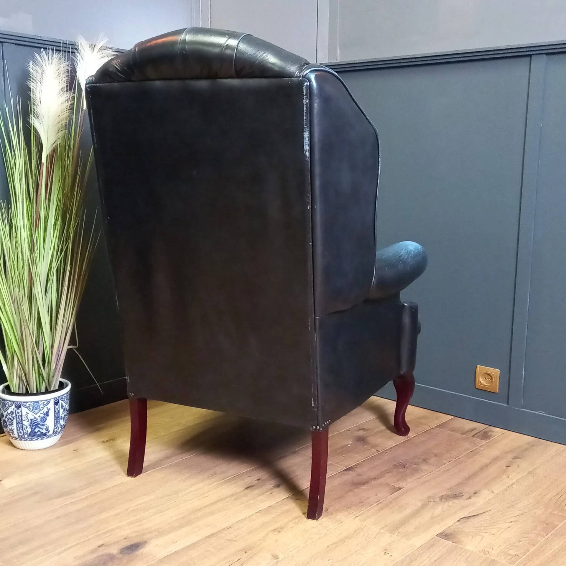 Blue chesterfield barrel back armchair