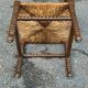 Brutalist corner chair in turned wood with straw bobbins, 1960.