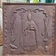 19th century cast iron fireback: bishop blessing the blacksmith's tools