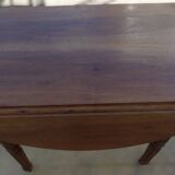 Antique round table with shutters in walnut wood on casters