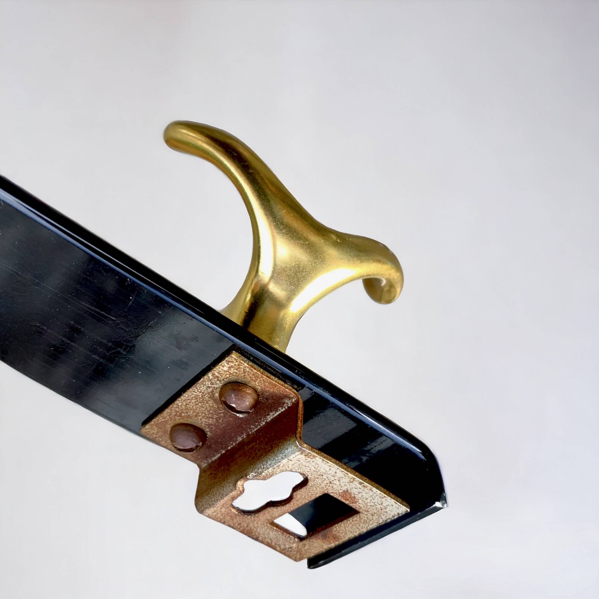 Vintage coat rack in lacquered metal with three golden aluminum hooks