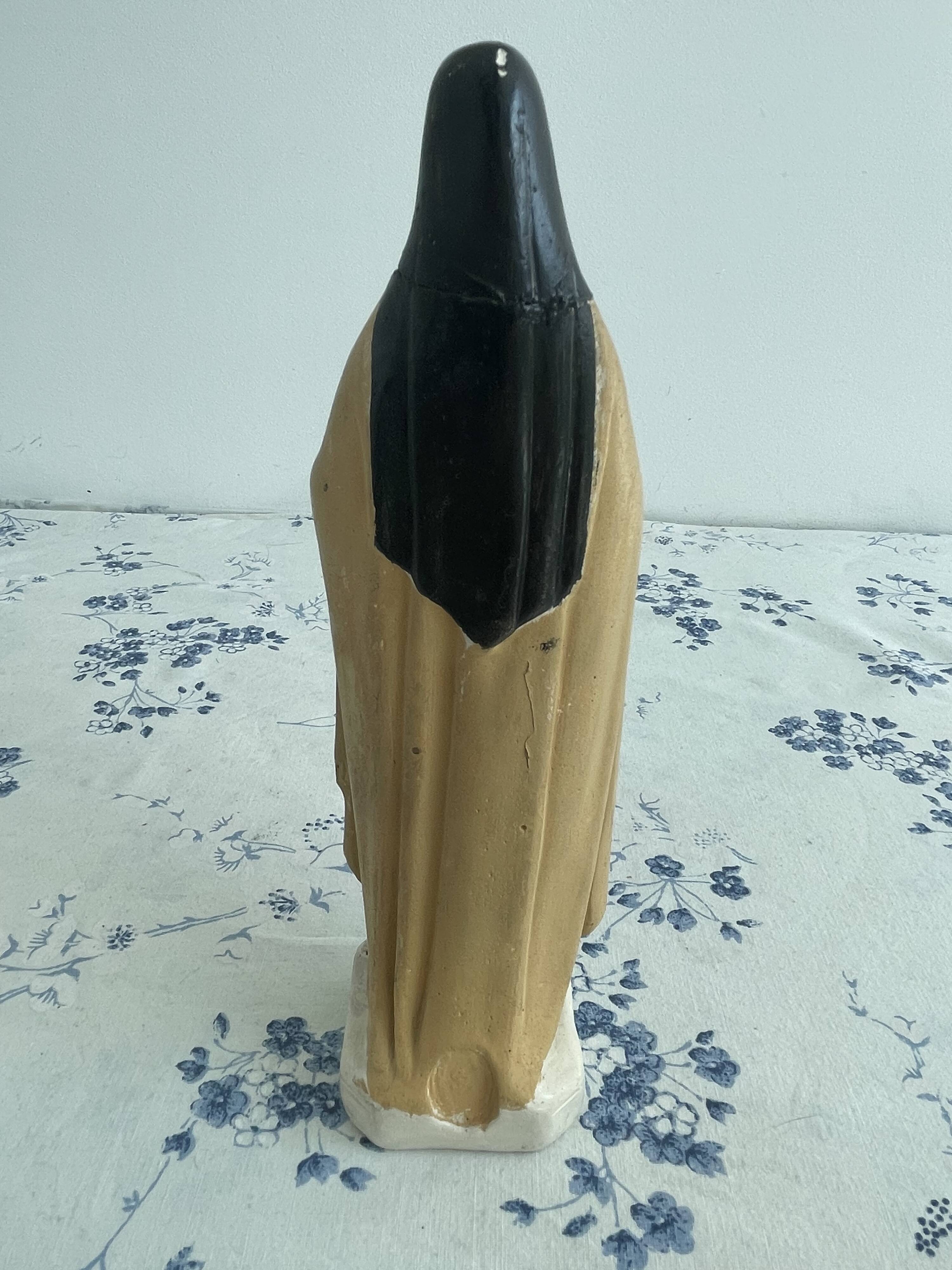 Antique statue of Saint Therese of Lisieux, religious plaster figurine