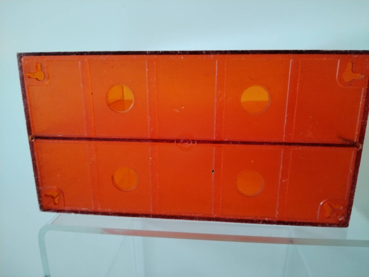 Vinyl magazine holder in orange plexiglass