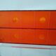 Vinyl magazine holder in orange plexiglass
