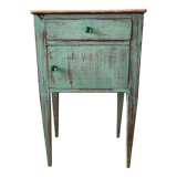 Patinated bedside table end of sofa