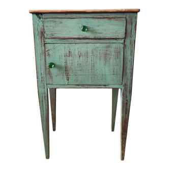 Patinated bedside table end of sofa