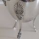 Empire-style silver-plated coffee pot with eagle head spout.