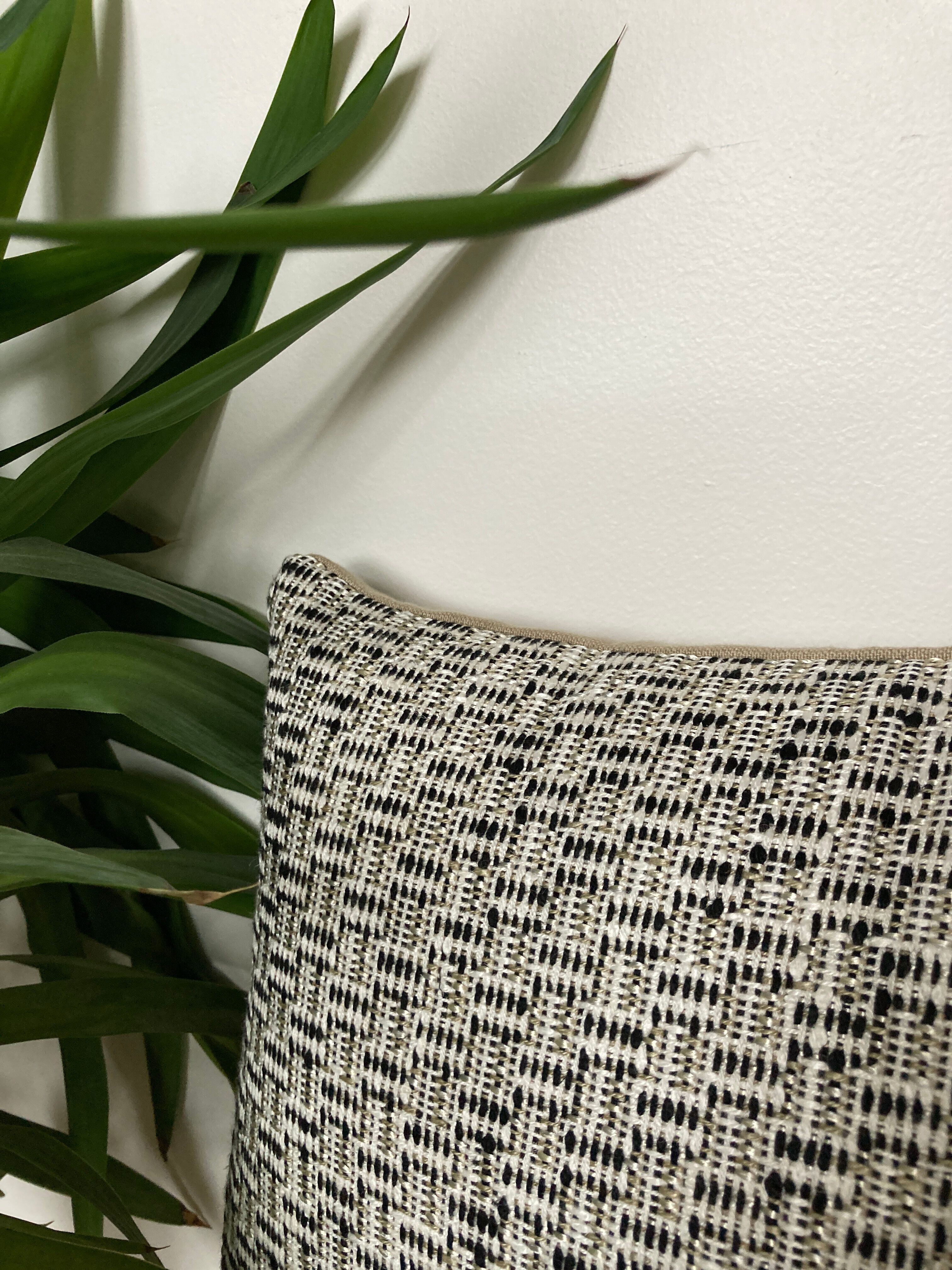 Bi-sided cushion beige black white pattern