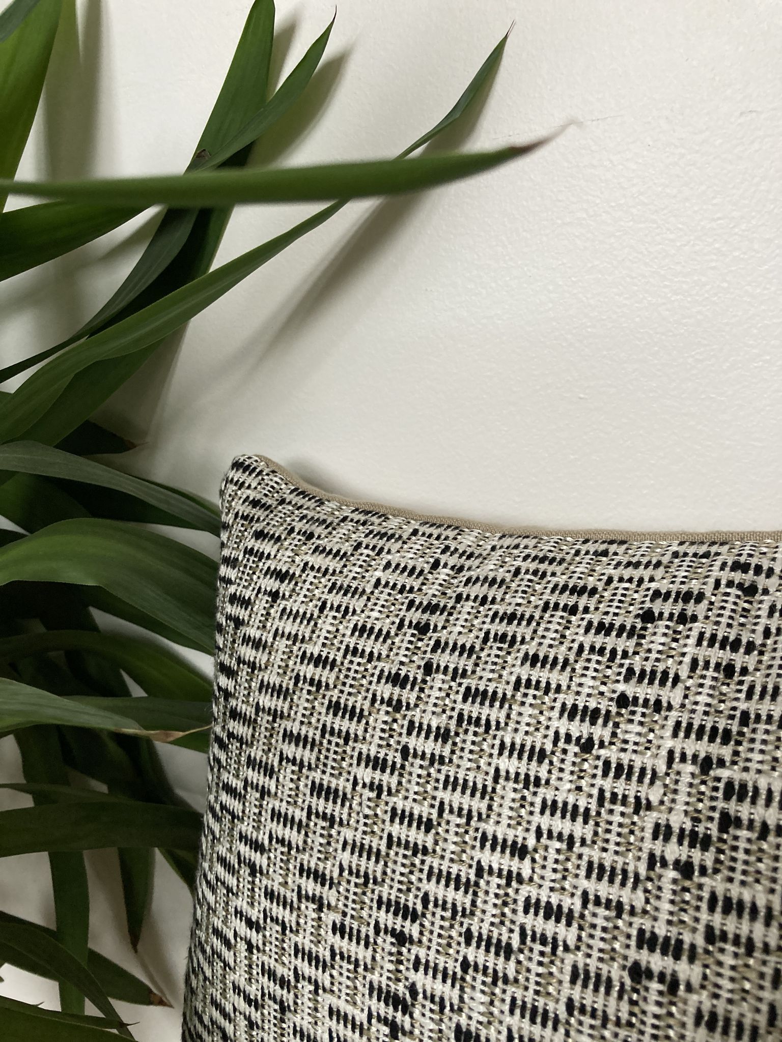 Bi-sided cushion beige black white pattern
