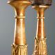 Pair of antique carved and gilded wooden candlesticks, Italy, 19th century.