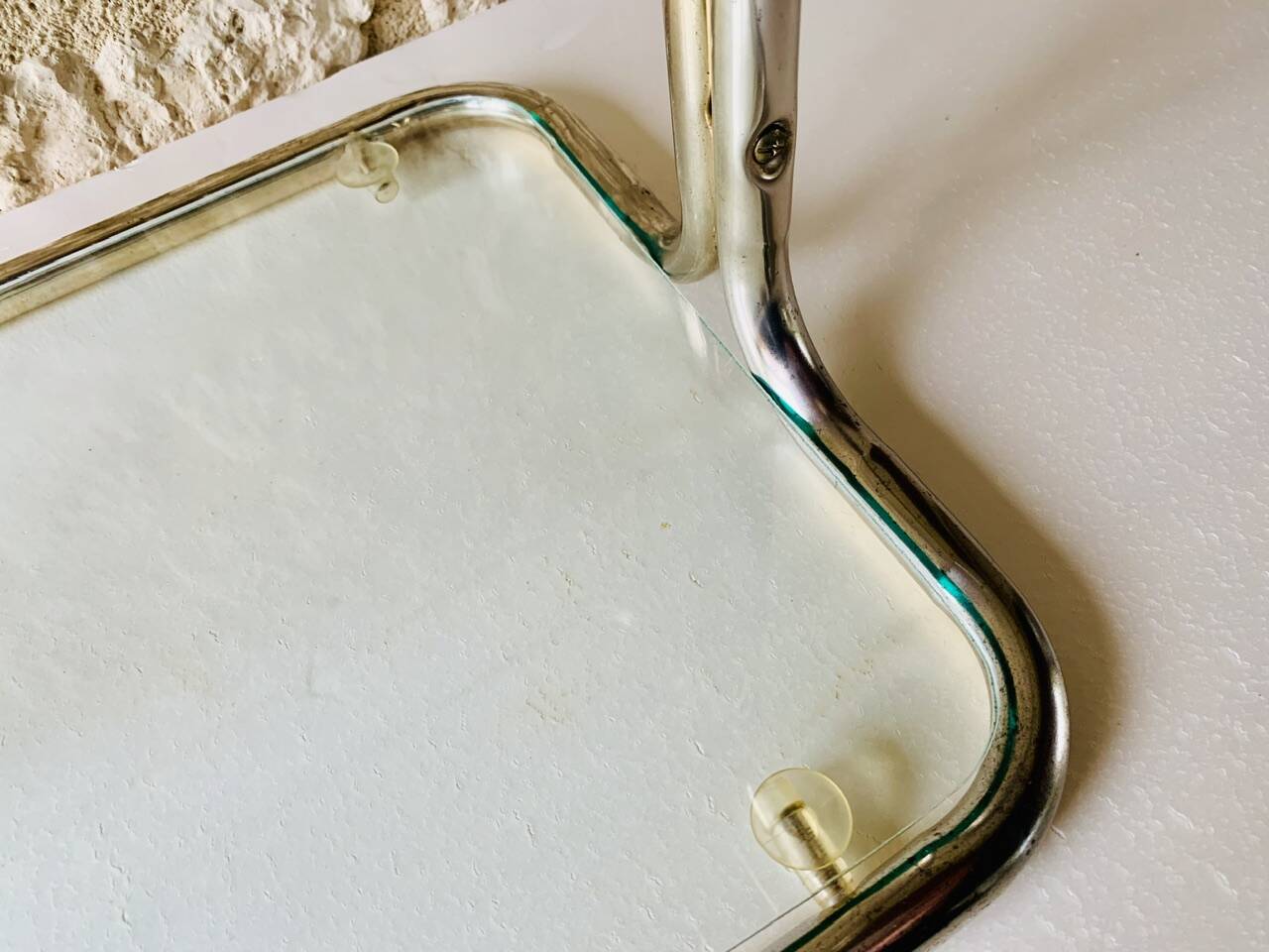 Glass and brass side table with magazine rack, circa 1970's