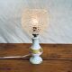 Porcelain table lamp and glass globe
