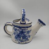 Earthenware watering can vase with floral decoration. St Clement.