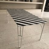 Iron table with top in black and white ceramic tiles