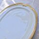 Very large oval dish with gold trim in Limoges porcelain by Peconnet.