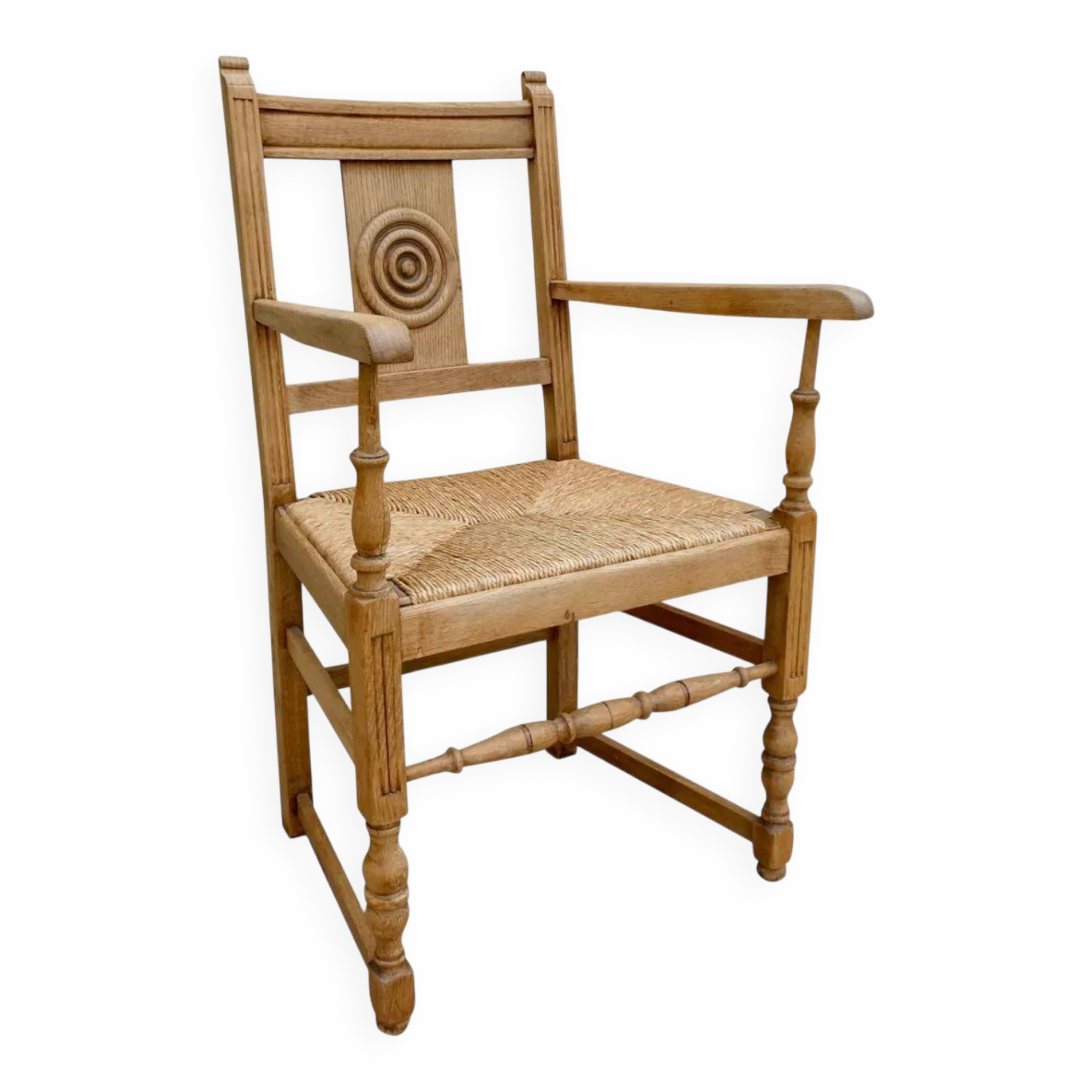 Light wood neo-Basque armchair with caned seat.