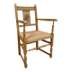 Fauteuil néo basque en bois clair et assise cannée