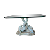 Table en verre avec pieds en bois sculpté poissons entrelacés
