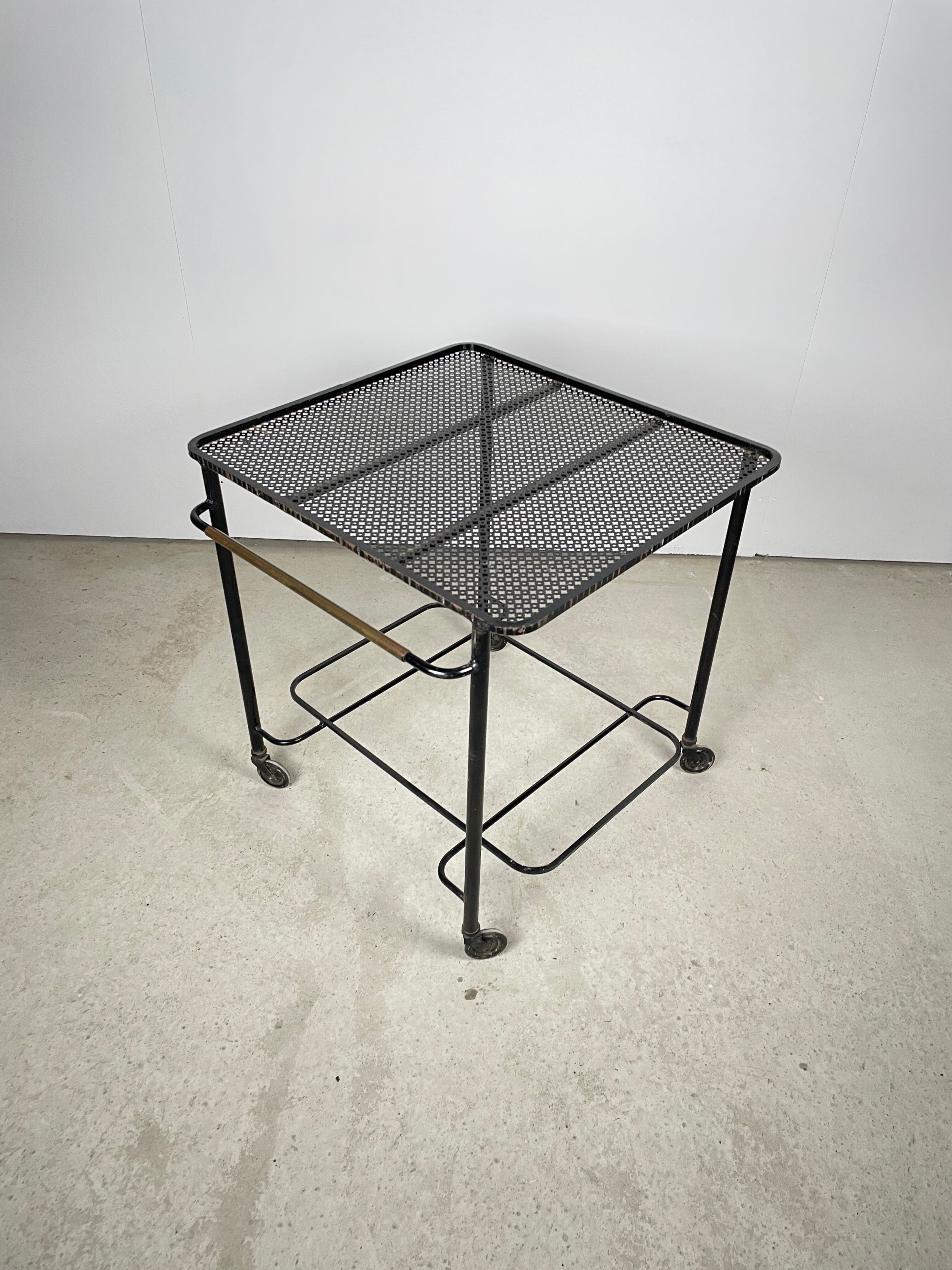 Trolley in perforated sheet metal