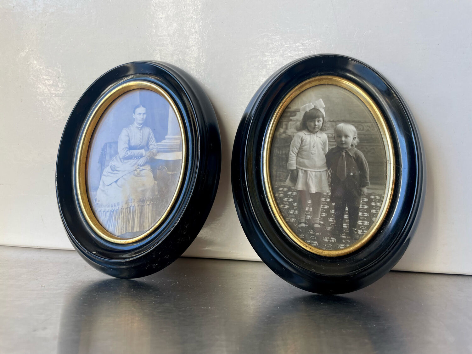 Pair of black wooden oval frames 1880’s  each 13 cm x 10 cm glass measurements 8.5 cm x 5.5 cm