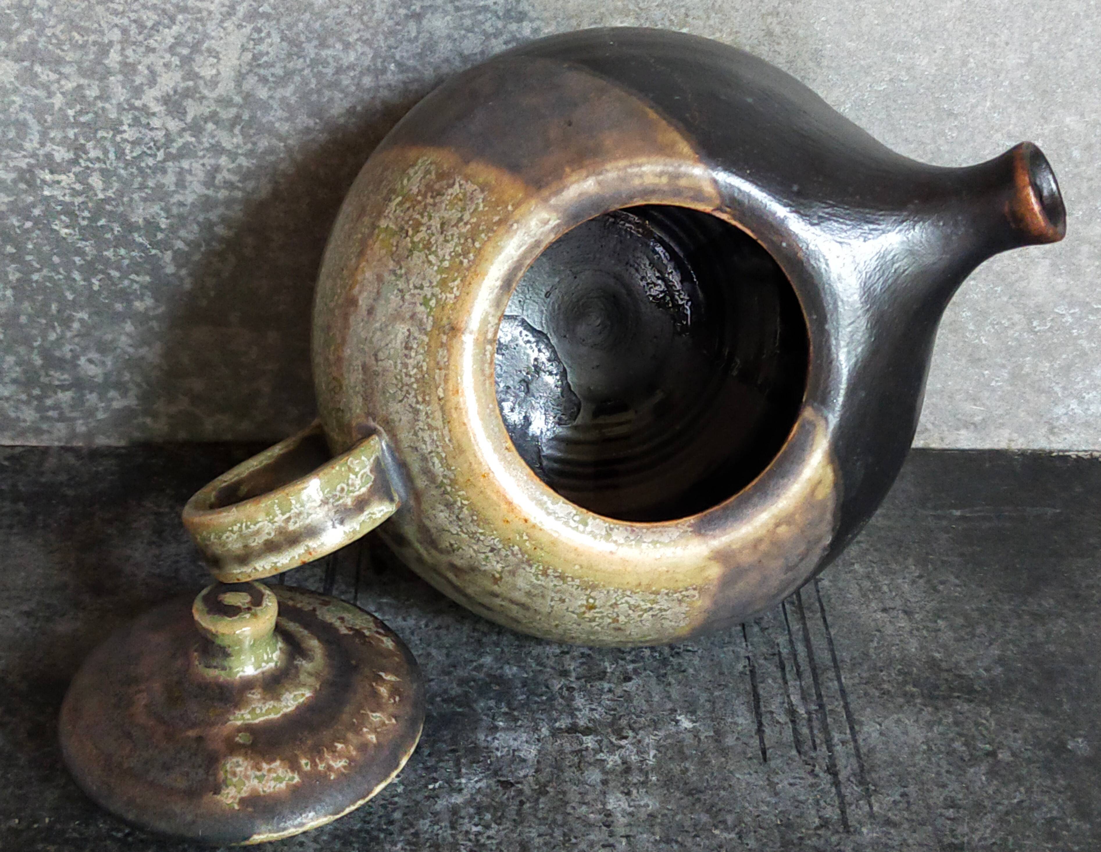 Vintage enameled stoneware potter's teapot