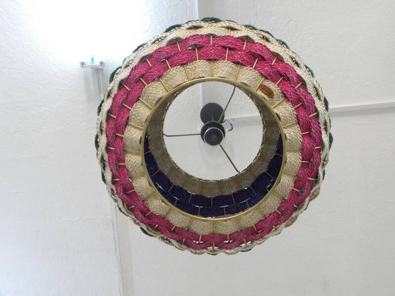 Handmade suspension in coloured woven natural plant fibres.