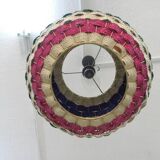 Handmade suspension in coloured woven natural plant fibres.