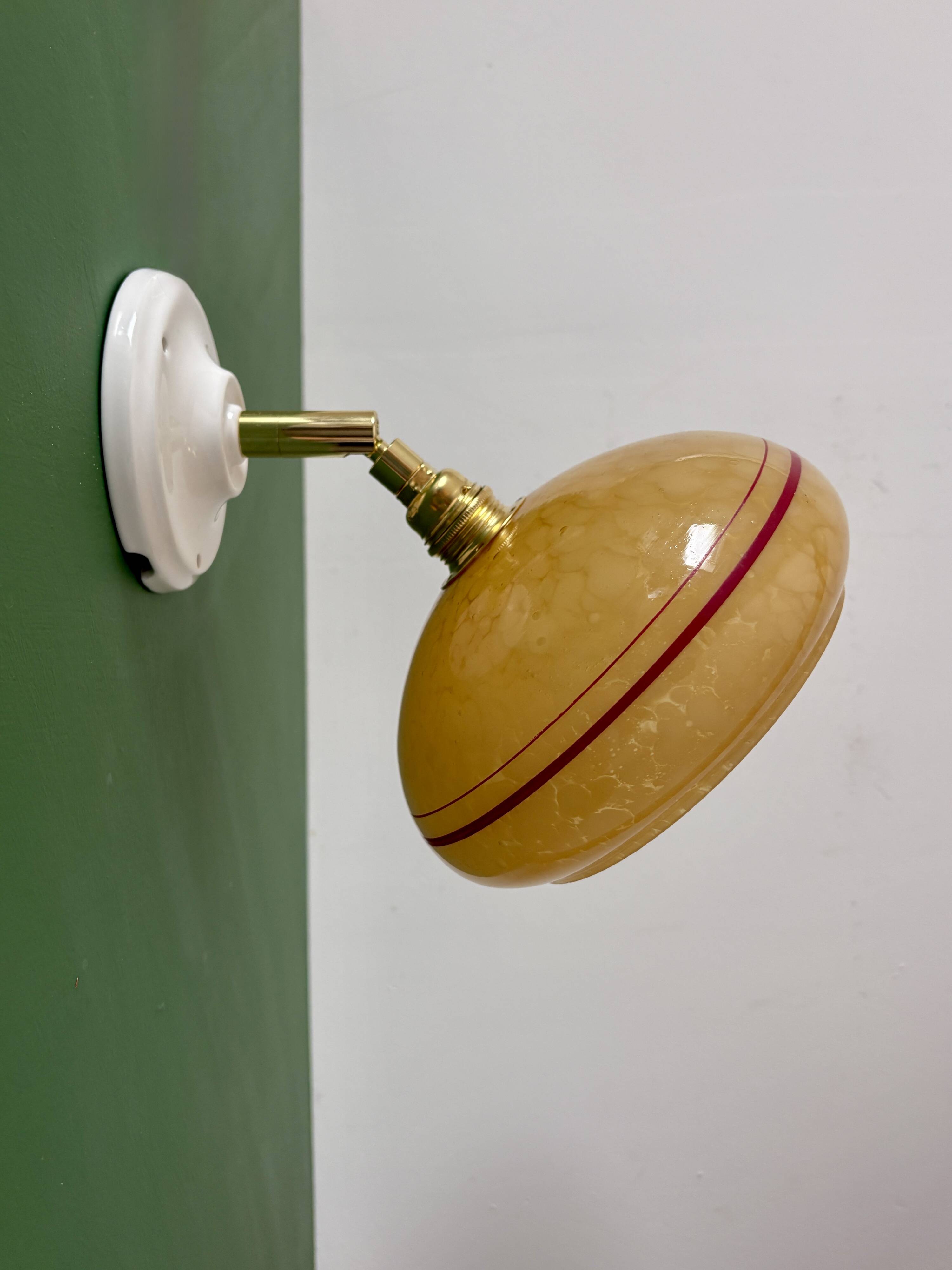 Vintage wall lamp with yellow clichy glass shade and red trim
