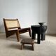 Black mango wood tripod side table with a semi-spherical top, height: 45 cm, diameter: 44 cm.