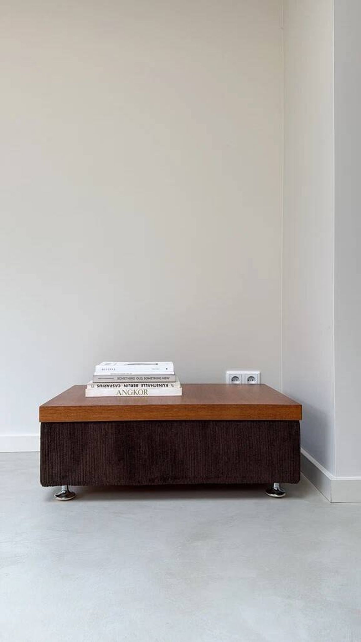 Coffee table with brown corduroy fabric, wooden top and chrome legs