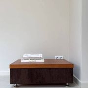 Coffee table with brown corduroy fabric, wooden top and chrome legs