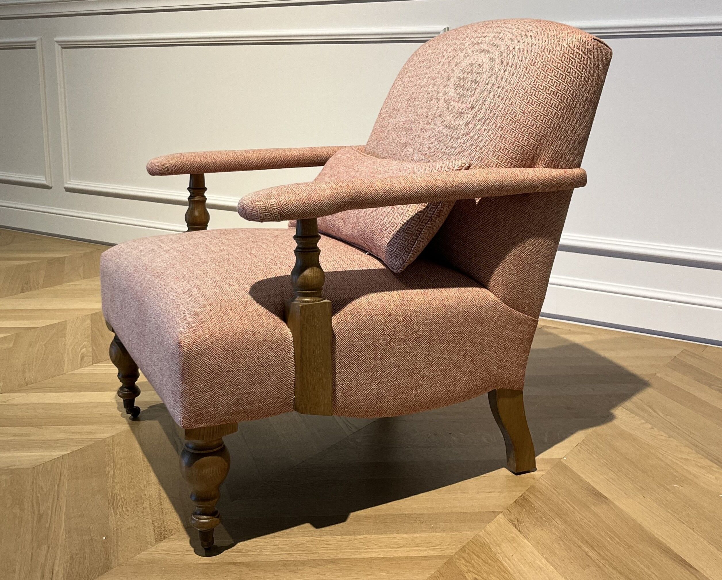 Wooden and red chevron fabric armchair with casters