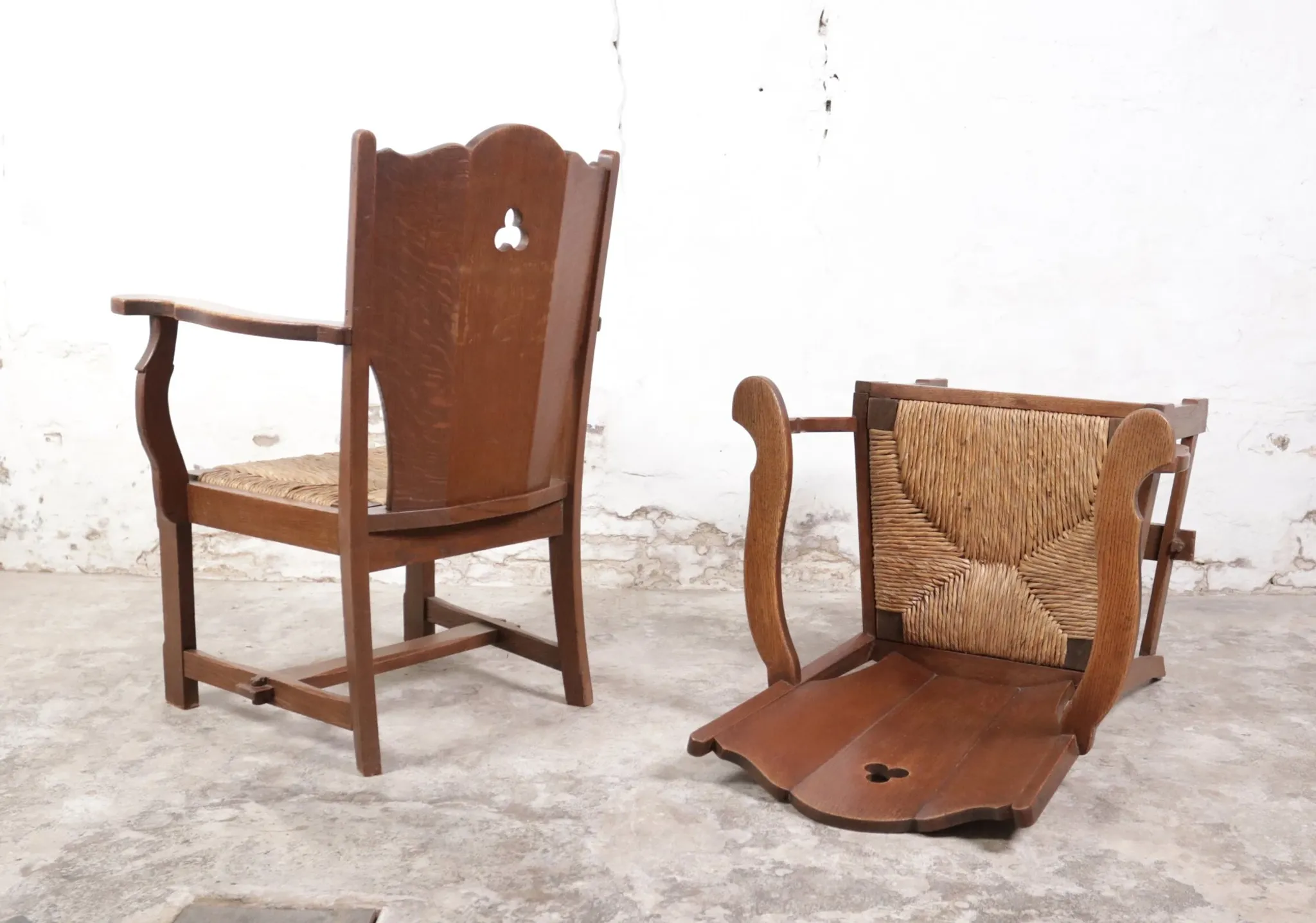 Pair of brutalist oak lounge chairs with rush seats – Netherlands