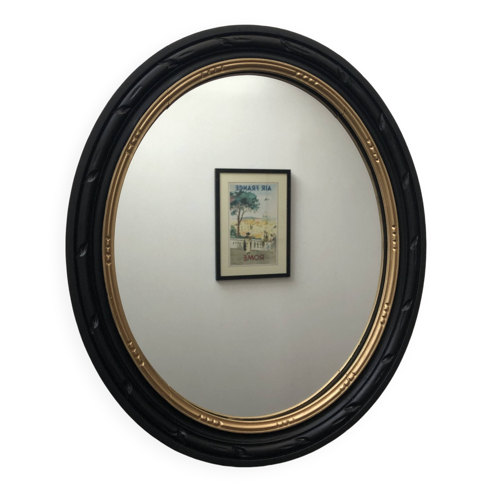 black and gold oval mirror