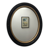 black and gold oval mirror
