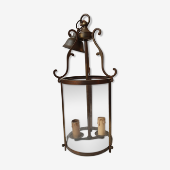 Ancient brass lantern and old bulging glass