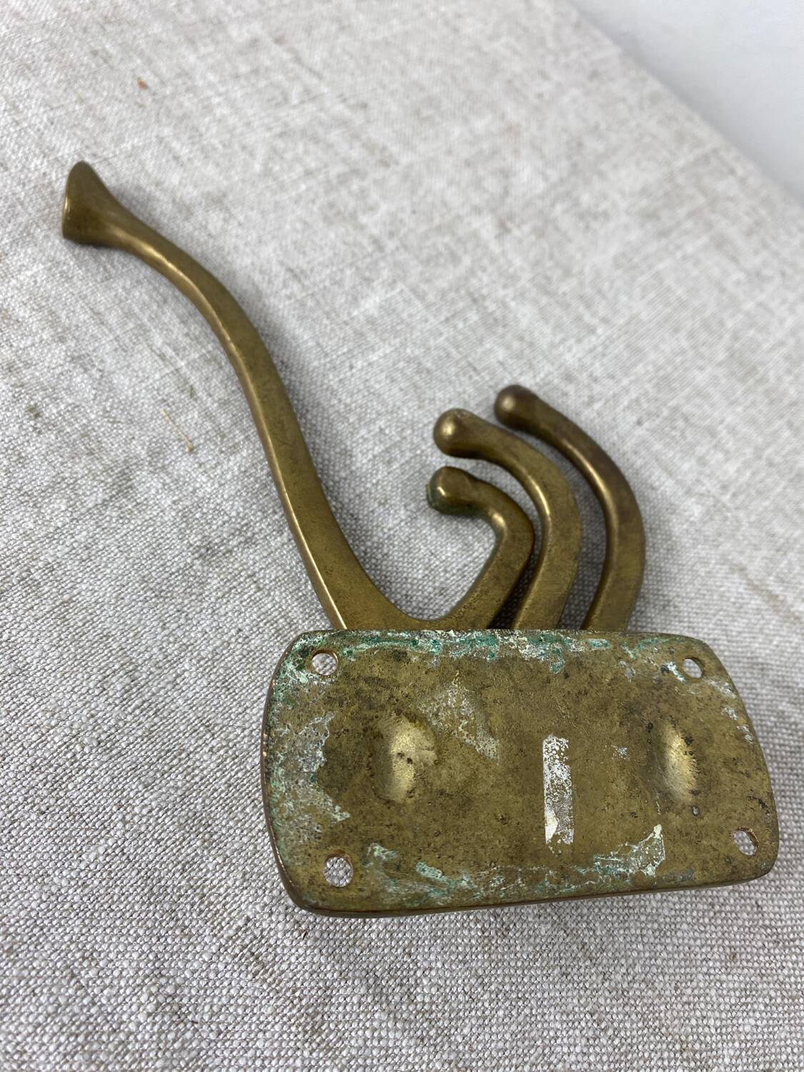 Three-pronged folding brass coat hook