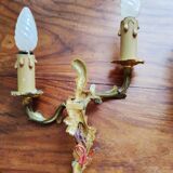 Pair of appliques with two arms of light with a leafy decoration