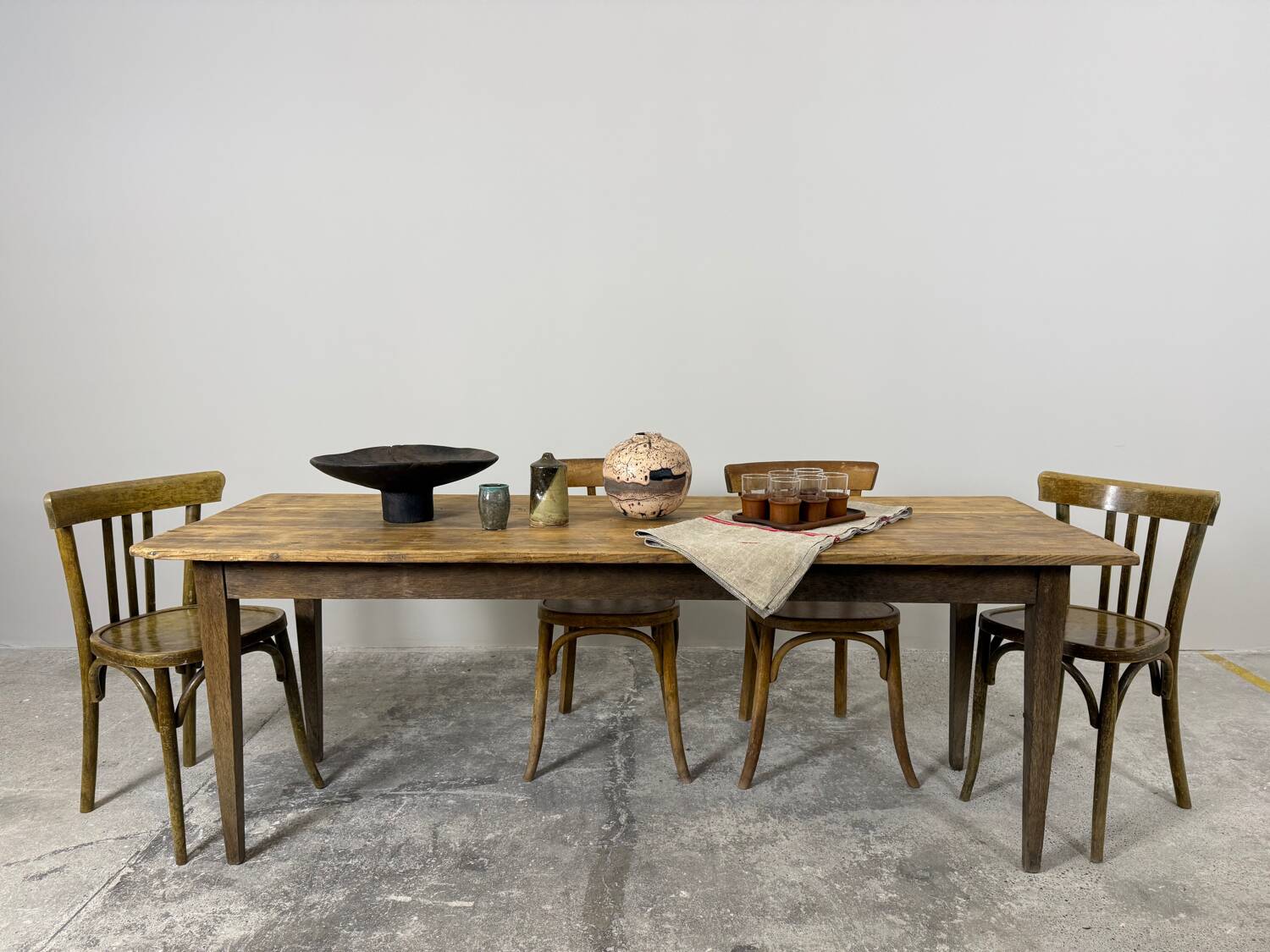 Old farmhouse table with tapered legs, late 19th to early 20th century.