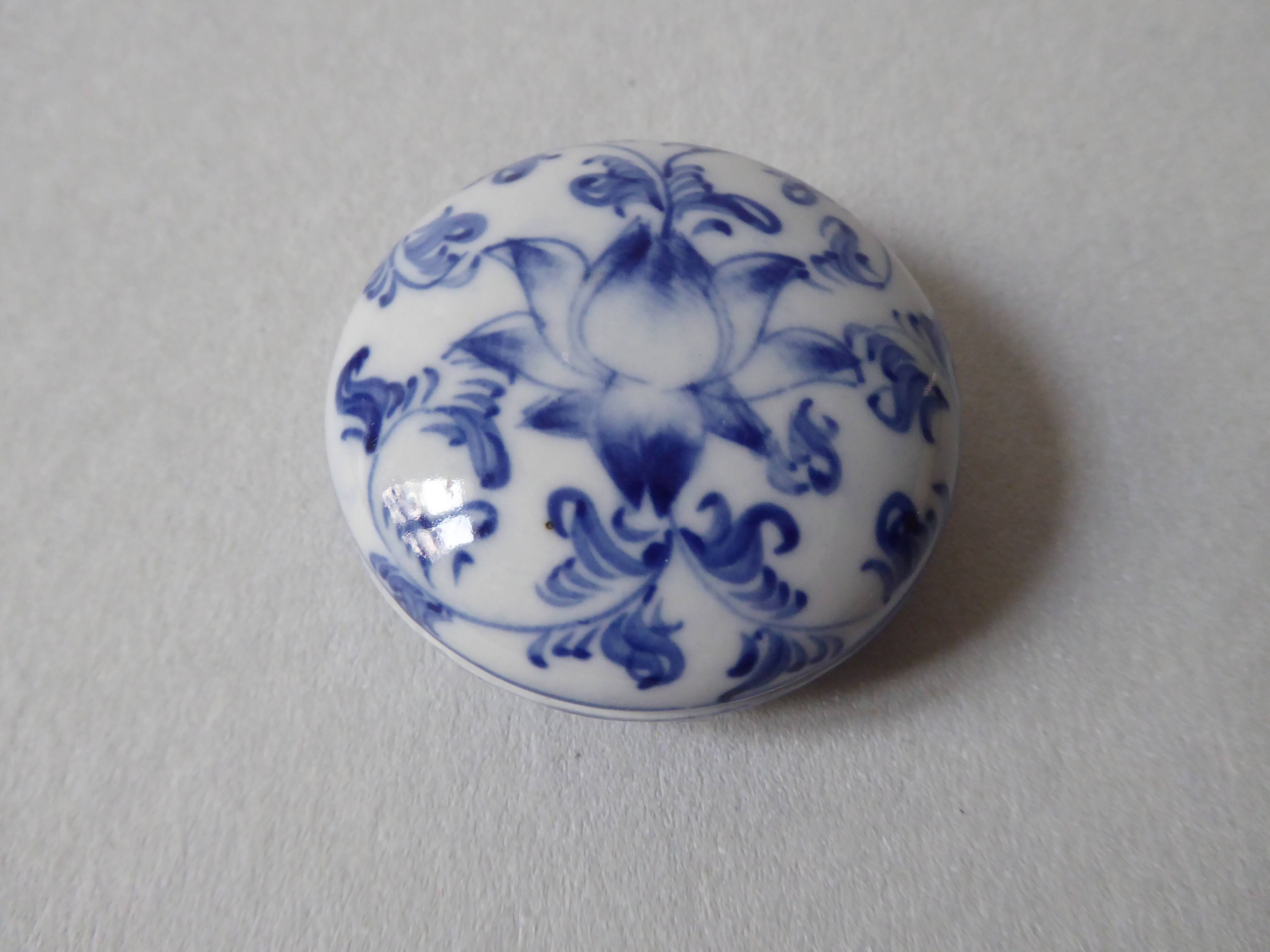 Porcelain pill box decorated with blue and white flowers