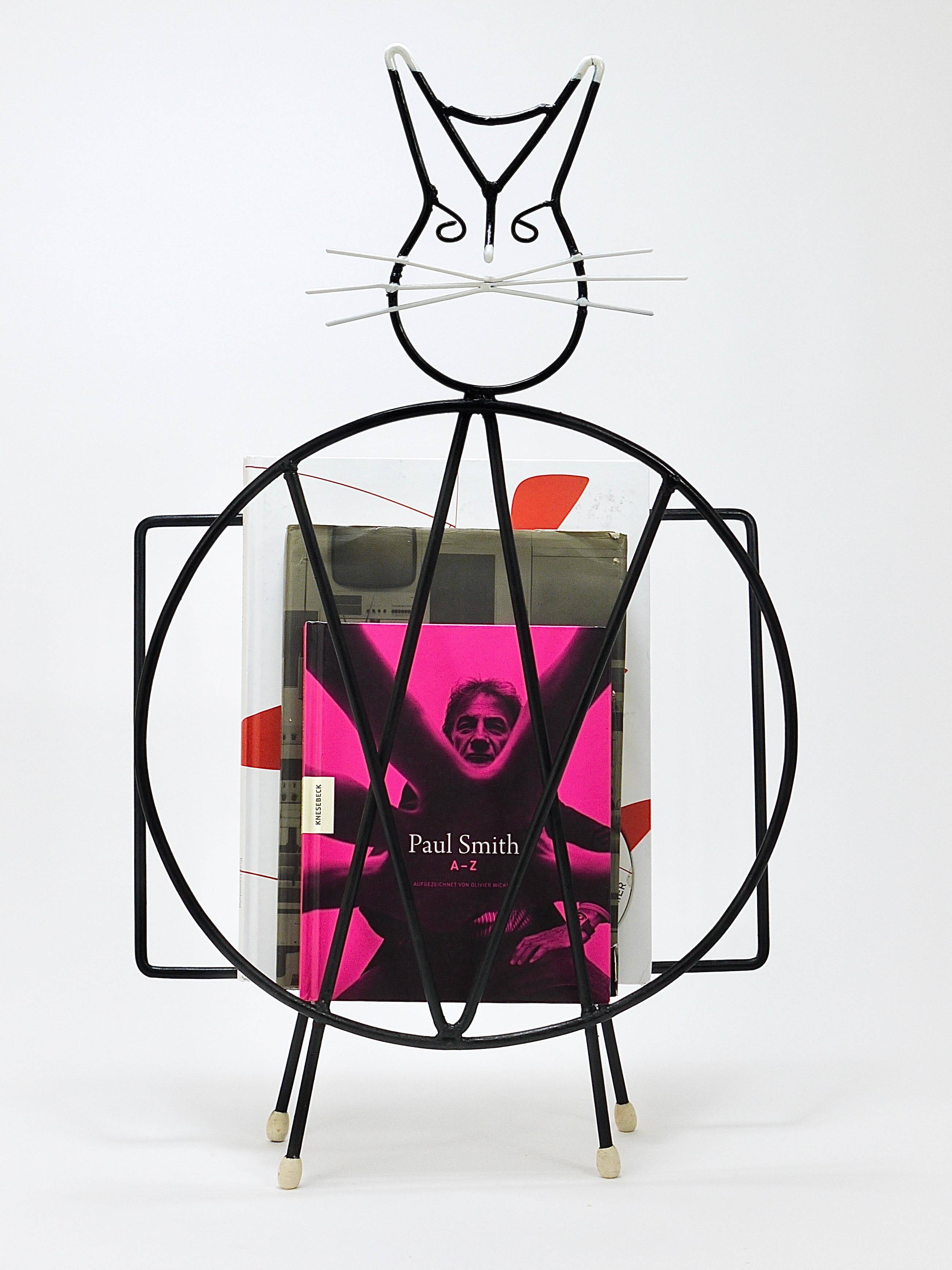 Mid-century cat-shaped magazine or record holder, iron, Italy, 1950s.