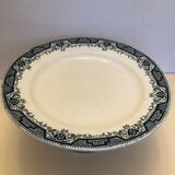 Earthenware display on metal pedestal