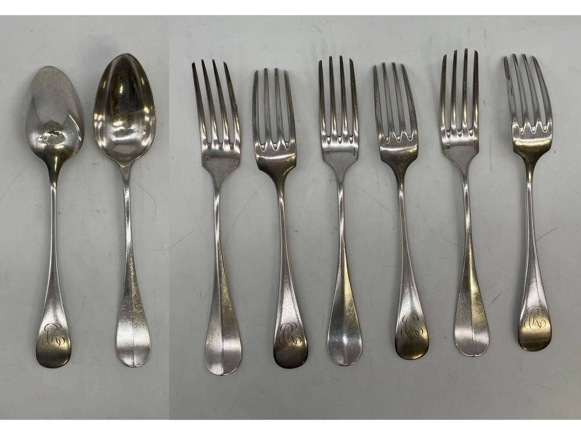 Set of 2 soup spoons and 5 lunch forks by Christofle.