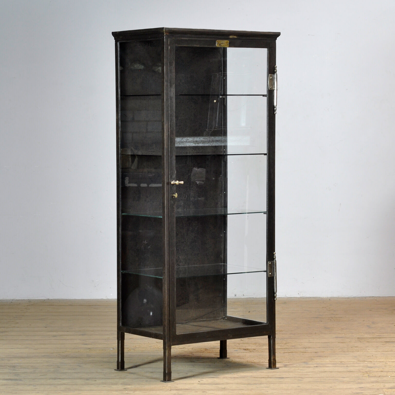 Polished iron medical cabinet, 1910s