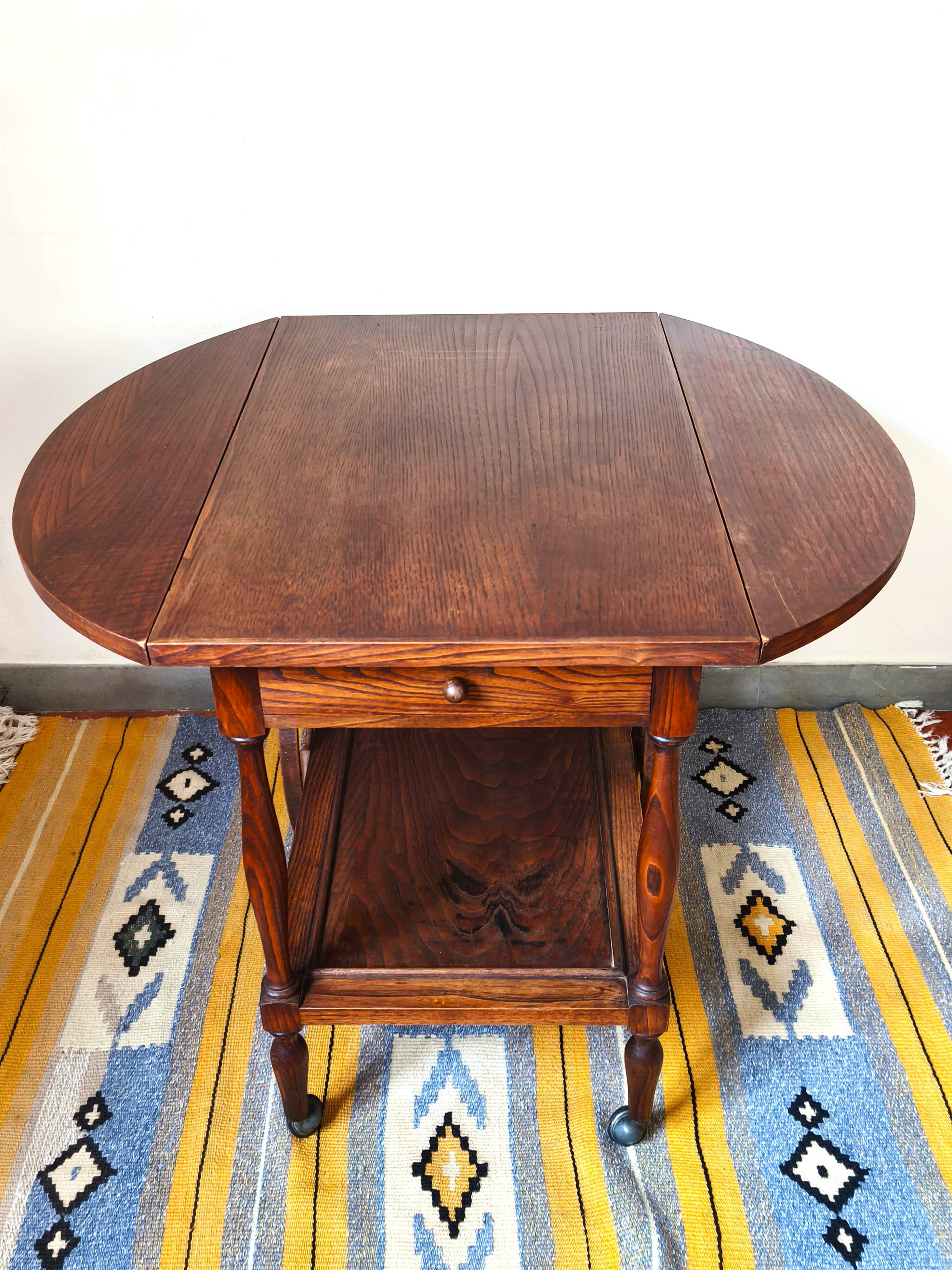 Folding dessert table in solid chestnut, 2 drawers, wheels, 20th century.