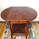 Folding dessert table in solid chestnut, 2 drawers, wheels, 20th century.