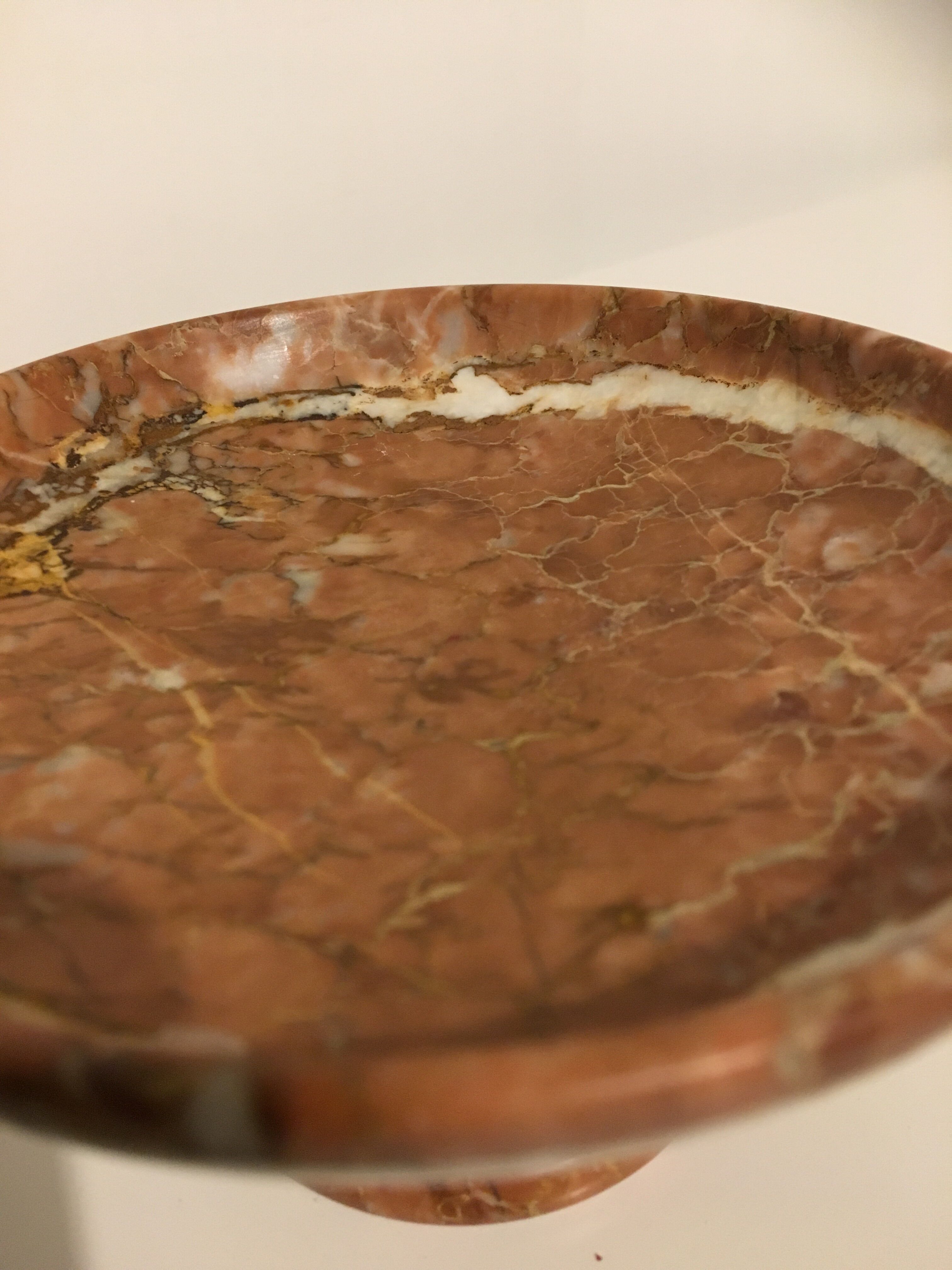 Empty pocket on foot in red marble